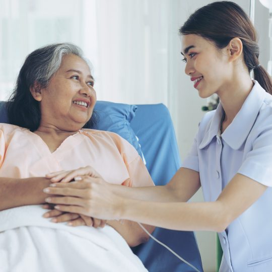 the nurses are well good taken care of elderly woman patients in hospital bed patients  feel happiness - medical and healthcare concept